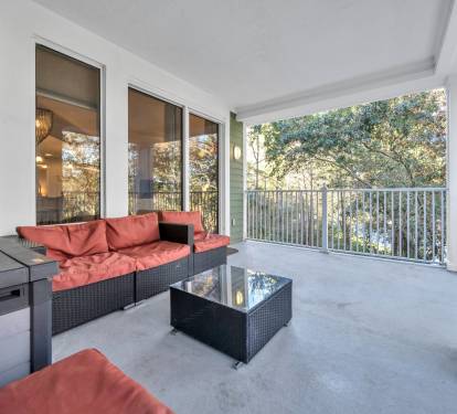 Relax on the 3rd floor patio among the trees