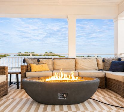 3rd floor rooftop patio that's 500sq ft, and has a rooftop fire pit, dining for 16, outdoor TV, grill, and beverage fridge