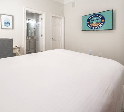 Bright bedroom offering a peaceful place to unwind after a full day.