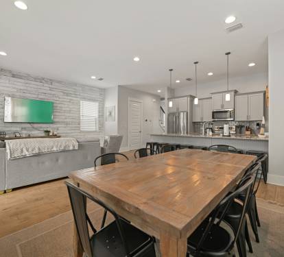 Open-concept dining and living area perfect for gathering and entertaining.