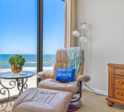 Floor to ceiling windows for immense view of the beach when relaxing in a leather chair in air conditioning!