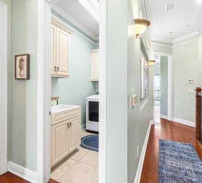 Landing at the top of the steps, hallway, entrance to the master bedroom, upstairs full bath, and laundry room.  