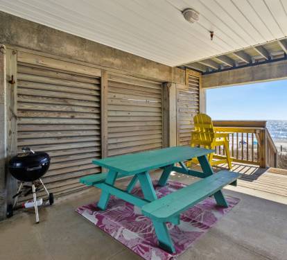 Downstairs patio with grill and picnic table