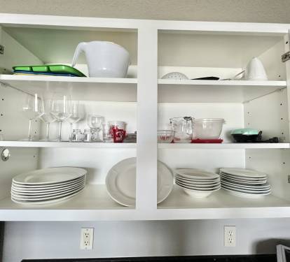 Fully stocked with pots, pans, dishes, silverware and glasses!