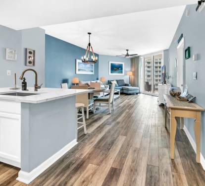 Open-concept view from the kitchen into dining & living areas, creating an easy, airy flow