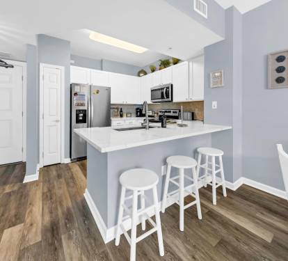 Bright kitchen w/ island seating, perfect for casual meals or morning coffee