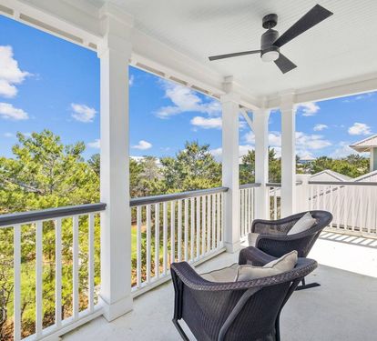 3rd floor back balcony overlooks beautiful green space.