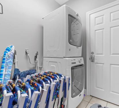 Laundry area. The beach gear is now behind the house in a bin.