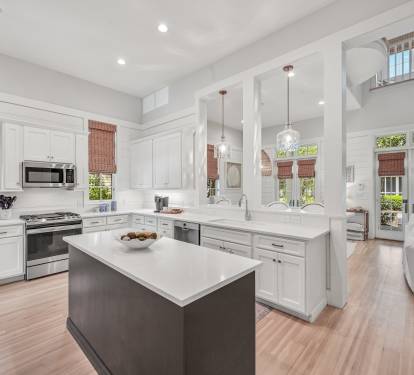Updated kitchen with quartz countertops and stainless steel appliances