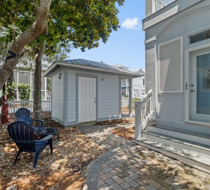 Side yard with fire pit, hammock & seating area