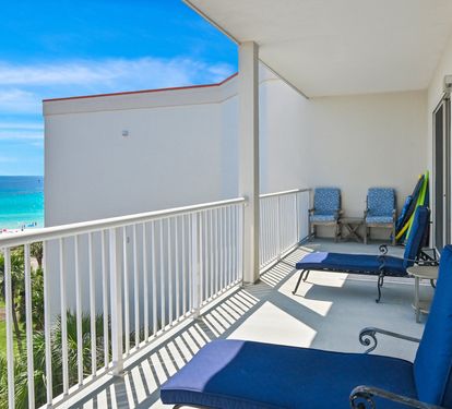 Balcony seating overlooking the sugar-white sand