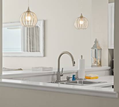 Clean, bright kitchen w/ generous counters and everyday essentials.