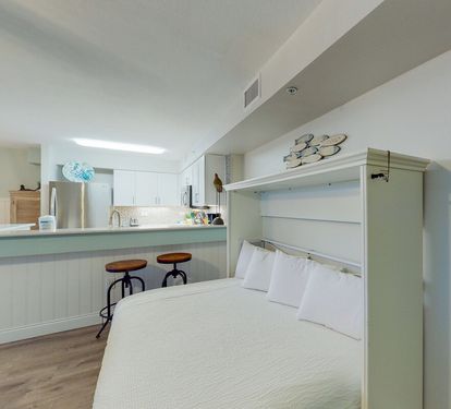 ?? "Extra Comfort, Extra Space. The full-size Murphy bed in the main living area offers a stylish and practical sleeping option—perfect for accommodating extra guests at After Dune Delight." ???