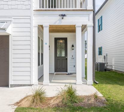 Cool Light Fixtures Outside and Front Door with Glass Panels to Express a Classy Feel