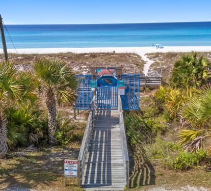 Walk out your gate, follow the palm-shaded boardwalk, and
step onto the sand. Your private Bid-A-Wee beach
access puts the Gulf just minutes from the back door.