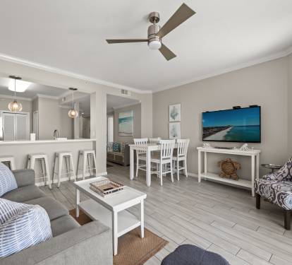 Family room w/ seating around a central island, great for gathering.