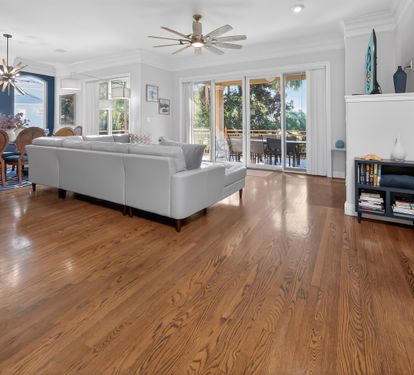 Open living area w/ wood floors and plenty of room to gather.