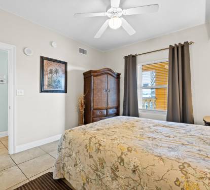 2nd bedroom has a flat screen tv and large armoire