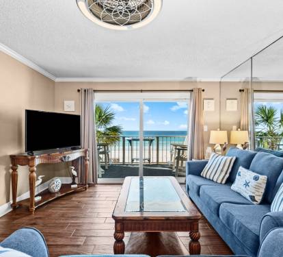Comfortable living space with Smart TV, balcony access and stunning view
