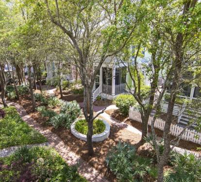 View of lush courtyard seen from master bedroom porch. The trees are lit @ nite.
