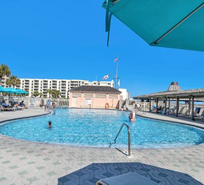Large sparkling pool w/ lounge chairs for sunny afternoons & refreshing dips.