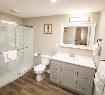 This bathroom is the en suite for bedroom 2.   This features a bathtub shower combo.  There is a hairdryer. 