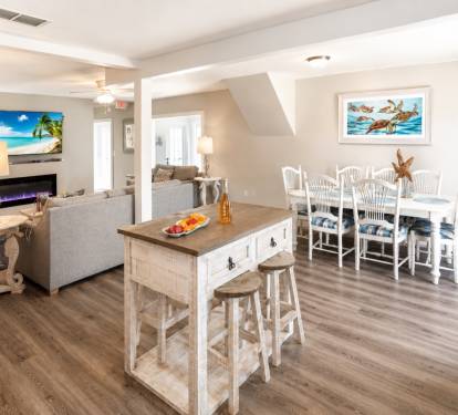 The full kitchen offers a dining room table, a breakfast bar with four stools, and an island table with 4 stools.  I has all the basic kitchen needs.  