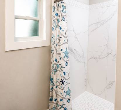 This bathroom is in the hallway.  Stand-up shower - hair dryer included 