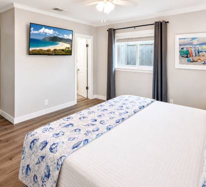 A King Suite with an en-suite full bathroom features a private primary bedroom with a king-size bed and an attached, dedicated full bathroom.  