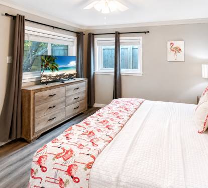 A King Suite with an en-suite full bathroom features a private primary bedroom with a king-size bed and an attached, dedicated full bathroom.  