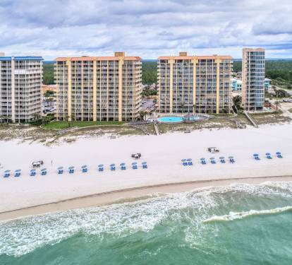 March through October, you can rent 2 chairs and an umbrella right out front.  2025 rates:  $45 first day, $35 second day, $30 each day thereafter.  High quality pair of Franklin beach chairs and an umbrella.   Reservations available.