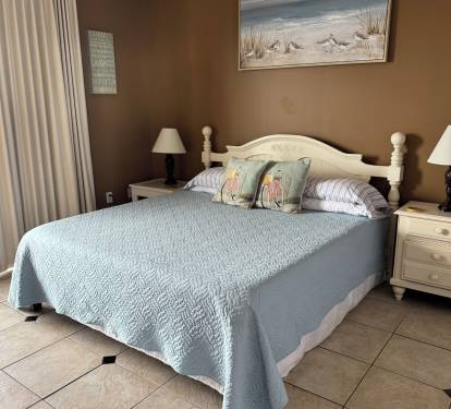 King size bed in guest room # 1. Has it's own sliding doors onto the. balcony.