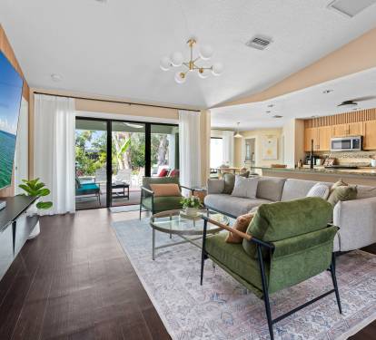 Bright, open living space with a spectacular view of the pool and patio.