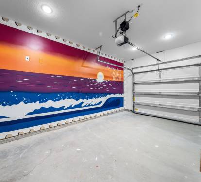 The garage mural offers a perfect background for an #Instaworthy photoshoot.