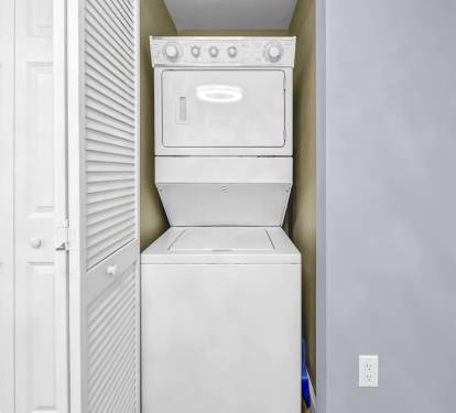In-unit washer & dryer tucked neatly away for added convenience during longer stays