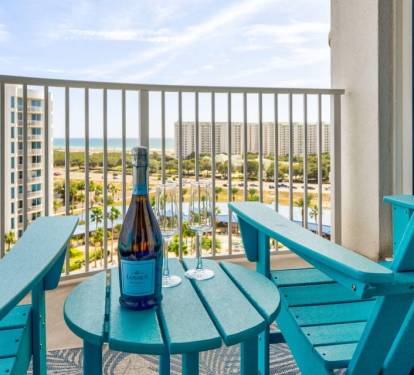 Balcony moment w/ chairs and table, ideal for evening drinks and laid-back views.