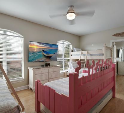 Second bunk room with twin-over-twin beds and bright windows