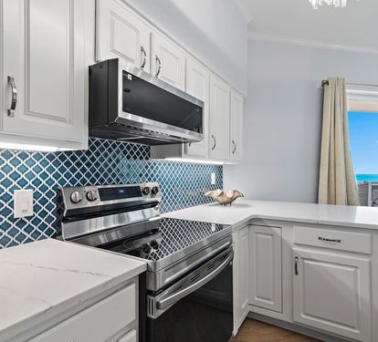 Stainless steel appliances and custom cabinetry
