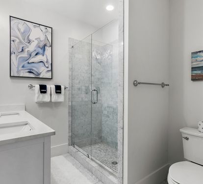 A master bathroom — double vanity, quality finishes, and enough space to actually get ready without a traffic jam.