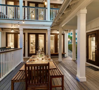The breezeway connecting the main house and carriage house — your private campus for 16 guests. Two separate living spaces, one seamless experience.