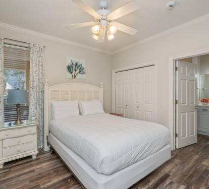 Guest bedroom w/ soft tones and a calm, inviting setup