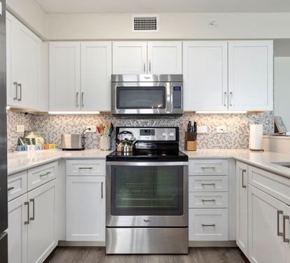?? "A Chef’s Dream. This updated kitchen features sleek granite countertops, a stunning tile backsplash, and stainless steel appliances—including a stove, refrigerator, dishwasher, and microwa