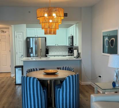 The kitchen table sits four people comfortably with an additional two seats at the kitchen countertop.