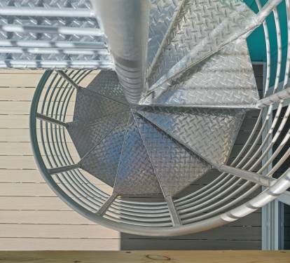 Spiral stair to rooftop deck