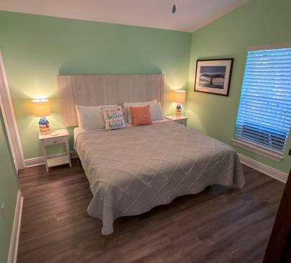 Second Floor Bedroom 5 combines simple comfort and beach-house style with inviting décor and a spacious King layout for unwinding.