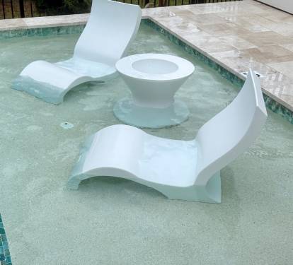 Ledge loungers with ice bin table — fill up the ice bin from the wet bar ice machine and enjoy cold drinks while you lounge the day away!