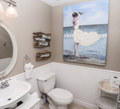 A Half Bath At Entrance