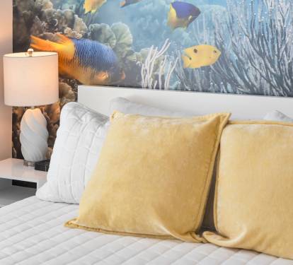 You sleep with the fish if you're lucky enough to get this room for your vacation.  A large underwater mural makes it seem like you could reach out and touch the fish while you fall asleep in the king size bed.