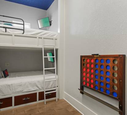 Bunk room featuring full-over-full bunk beds with built-in storage—great for kids or teens.