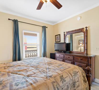 Queen bedroom with tv